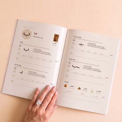 The workbook open at the letter ba, with tracing lines